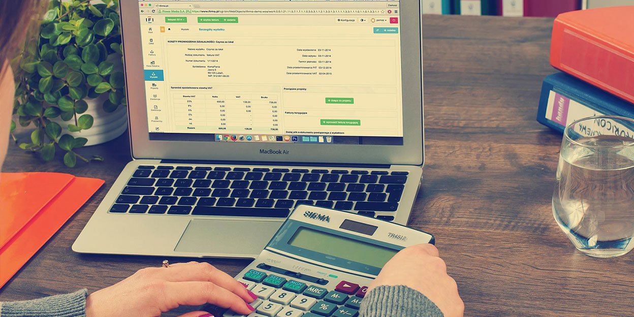 Laptop and calculator used for accounting