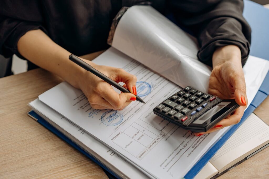 VAT Return Filing in Dubai UAE with Trusted Professionals 5 Calculator and financial documents prepared for audit assessment.