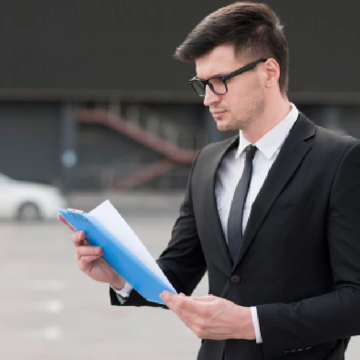 Businessman reviewing audit documents