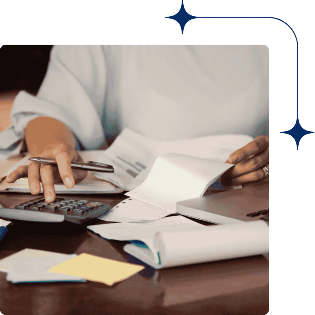 An auditor working on a laptop with DDA documentation visible on the table, symbolizing official approval and regulatory adherence.