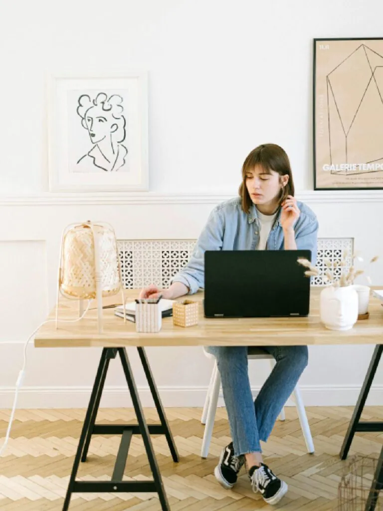 Focused Young Woman Working from Home Office