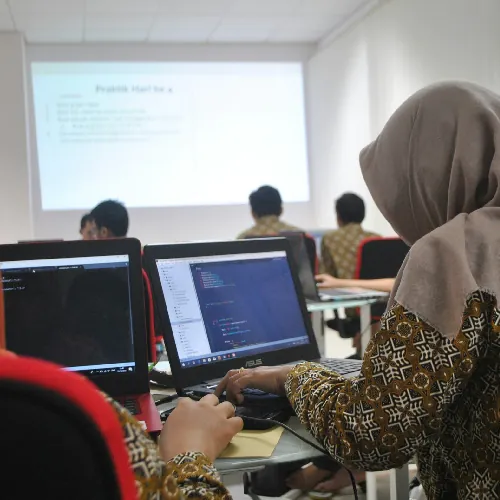 Students Engaged in Coding and Programming