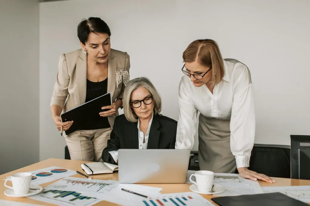 Professional women auditors collaborating Capital Plus UAE